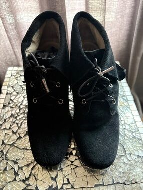 MK-Michael Kors suede wedge booties with tie laces.